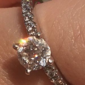 Round engagement ring with diamond band
